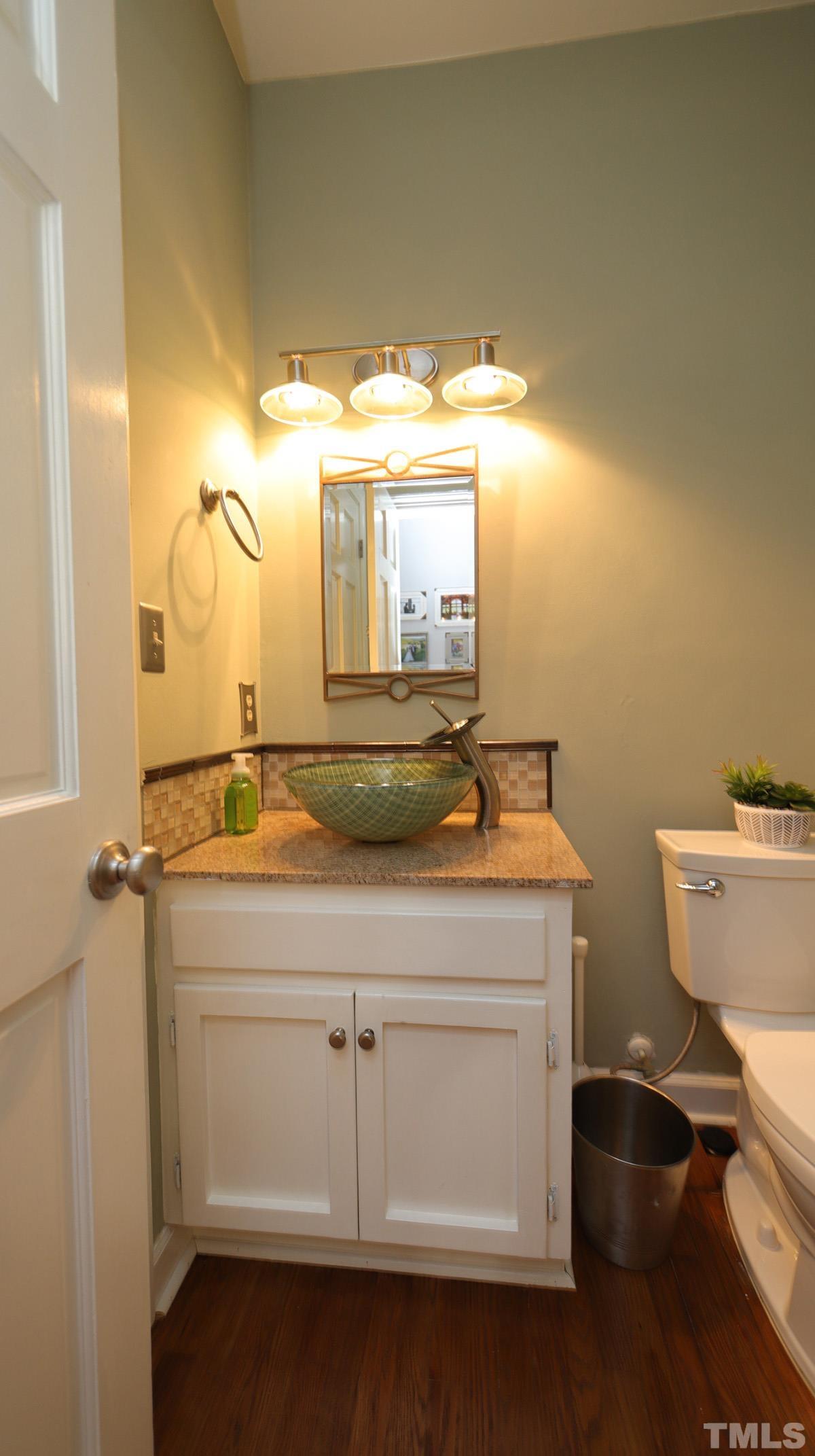 7614 Wilderness Road Raleigh, NC 27613 - Photo 6 of 21 Half bath located off foyer.