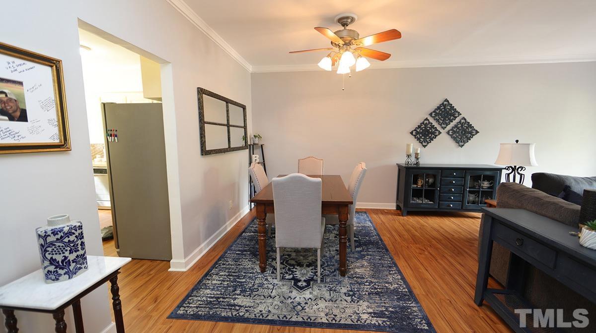 7614 Wilderness Road Raleigh, NC 27613 - Photo 7 of 21 Entertain in the ample dining area that is between the kitchen area and family room.