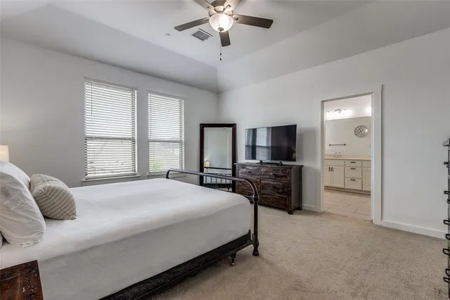a spacious bathroom with a shower a sink and mirror
