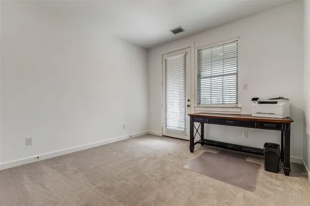 a bathroom with a granite countertop bathtub shower sink vanity mirror and toilet