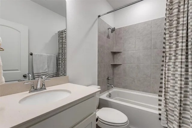 a view of a brick house with a balcony