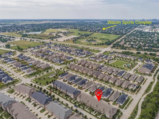 an aerial view of a house with outdoor space