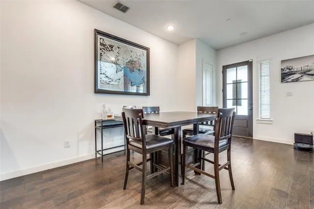 a living room with stainless steel appliances kitchen island granite countertop furniture a rug and a view of kitchen