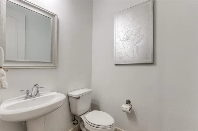 a bedroom with furniture and a flat screen tv