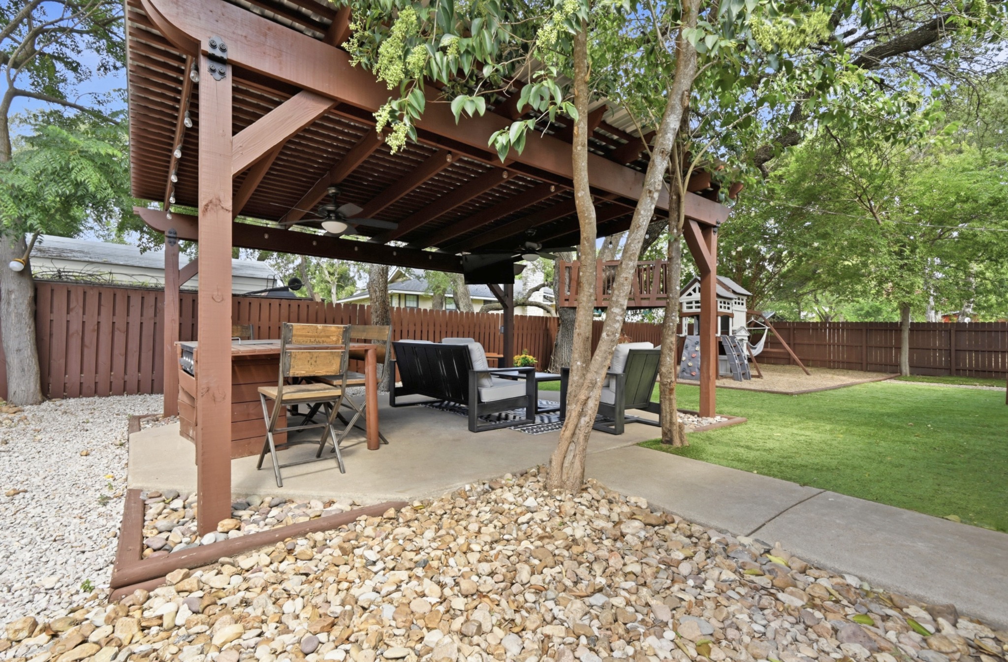 303 Pin Oak Drive Georgetown, TX 78628 - Photo 30 of 36 a view of a chairs and table in backyard of the house