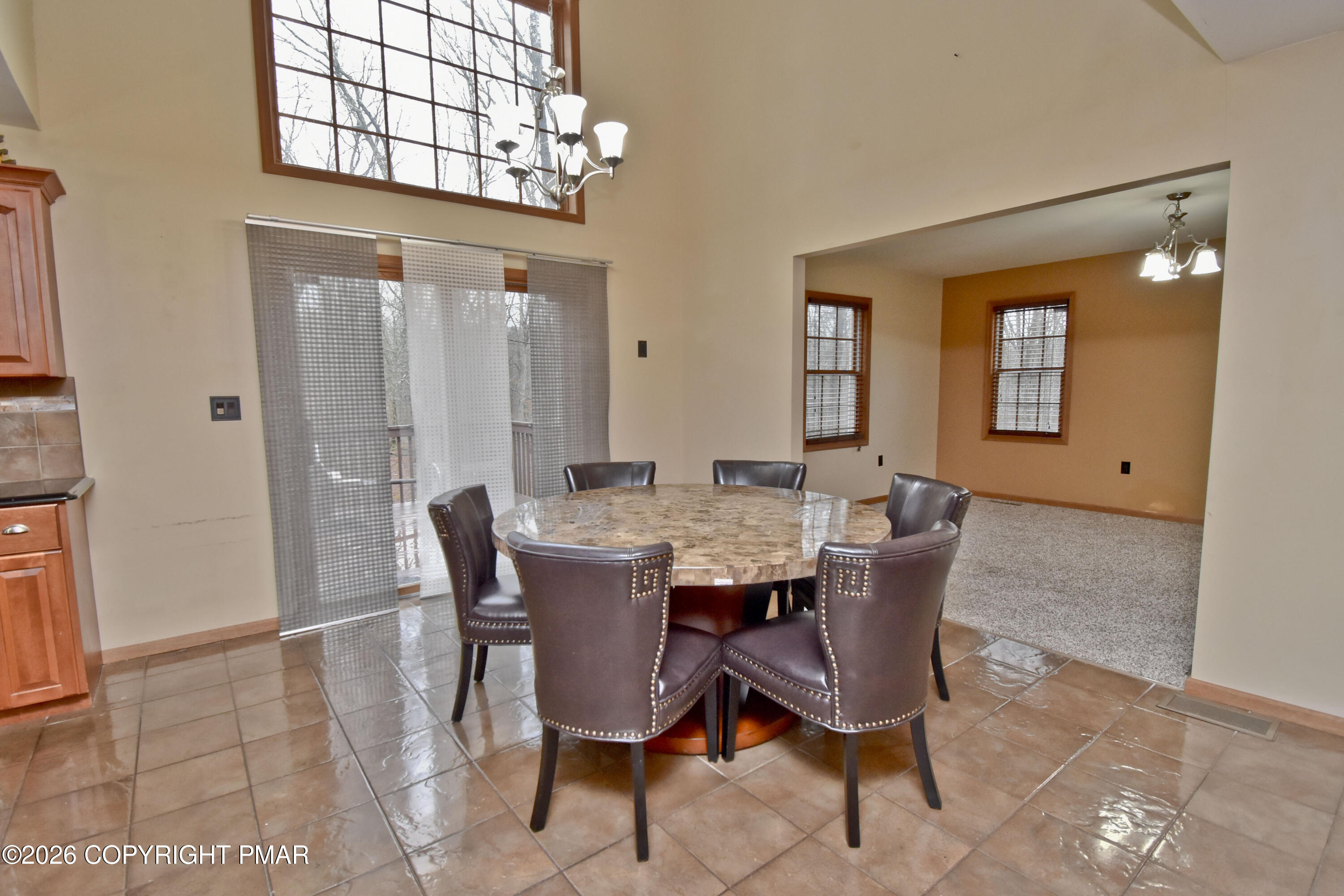 131 Canterbury Road Bushkill, PA 18324 - Photo 14 of 65 a view of a dining room with furniture and chandelier
