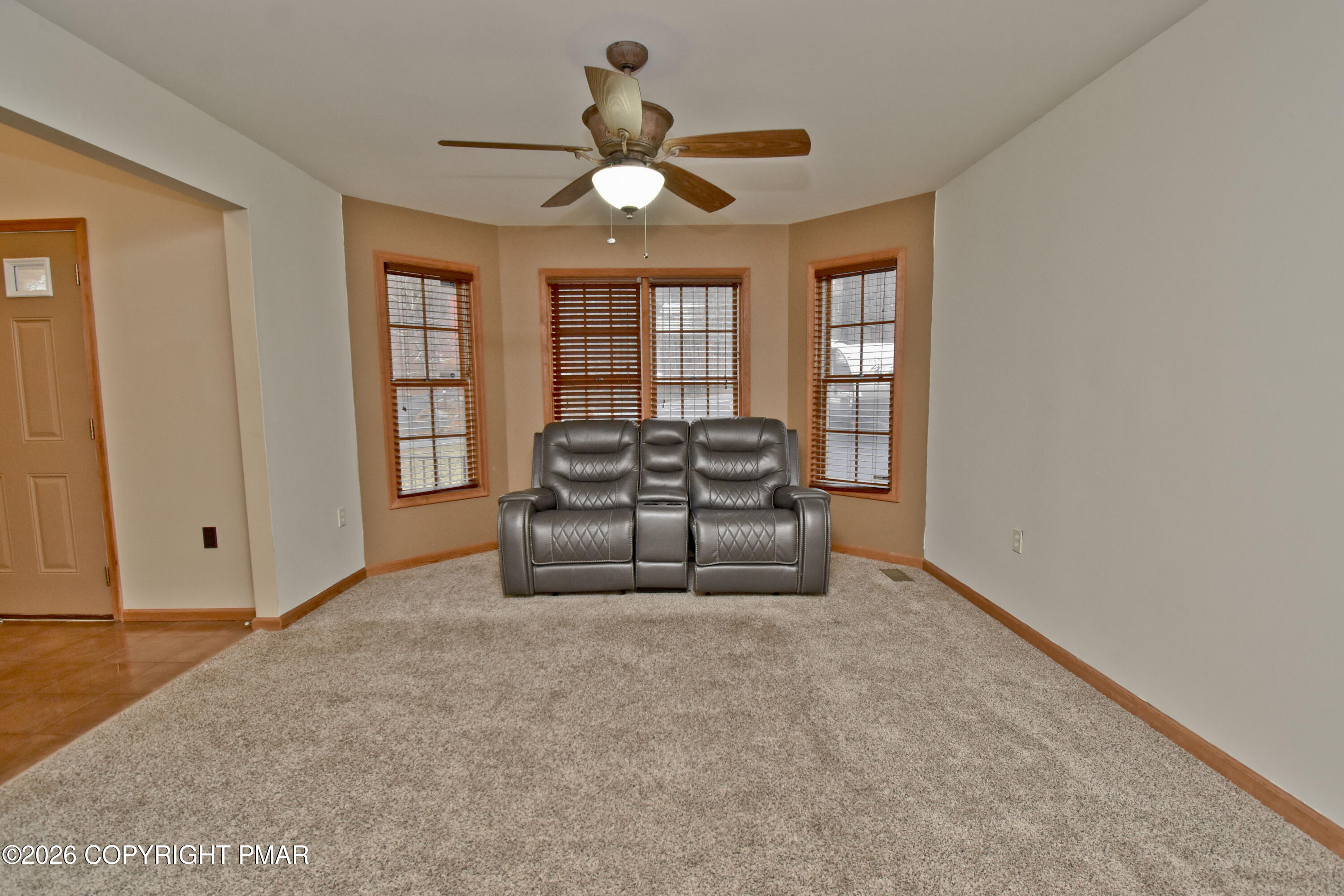 131 Canterbury Road Bushkill, PA 18324 - Photo 20 of 65 a living room with furniture and window