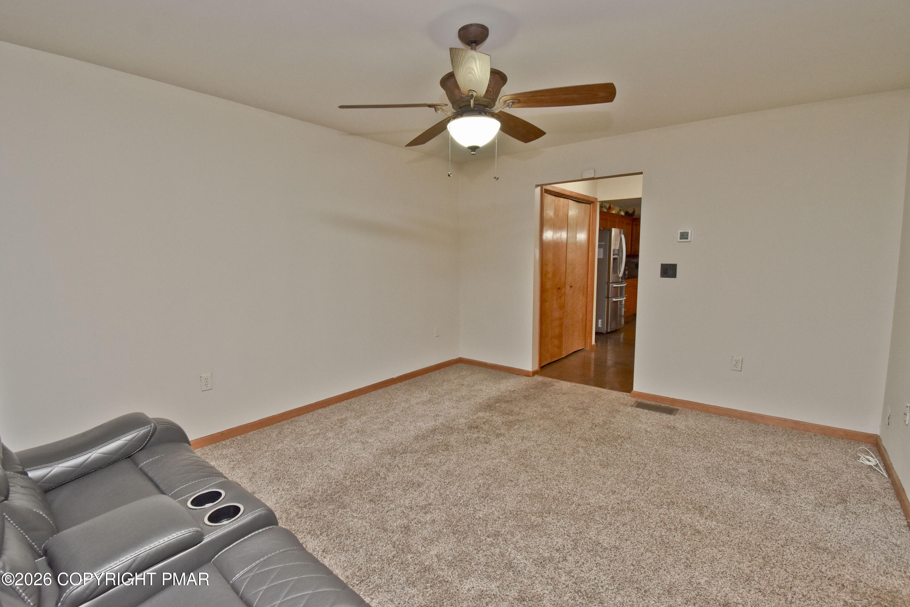 131 Canterbury Road Bushkill, PA 18324 - Photo 21 of 65 an empty room with a ceiling fan and a window
