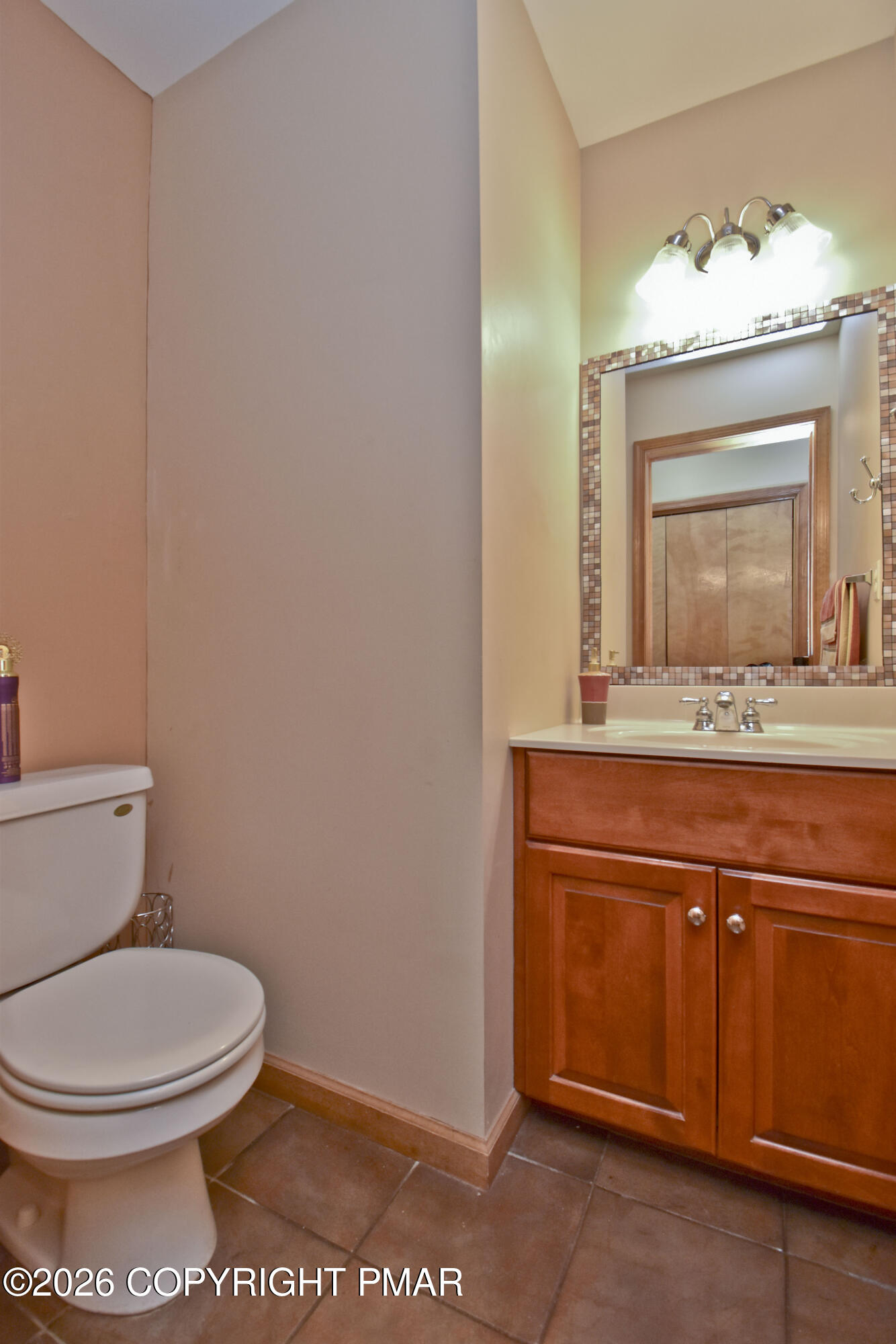 131 Canterbury Road Bushkill, PA 18324 - Photo 23 of 65 a bathroom with a toilet sink and mirror