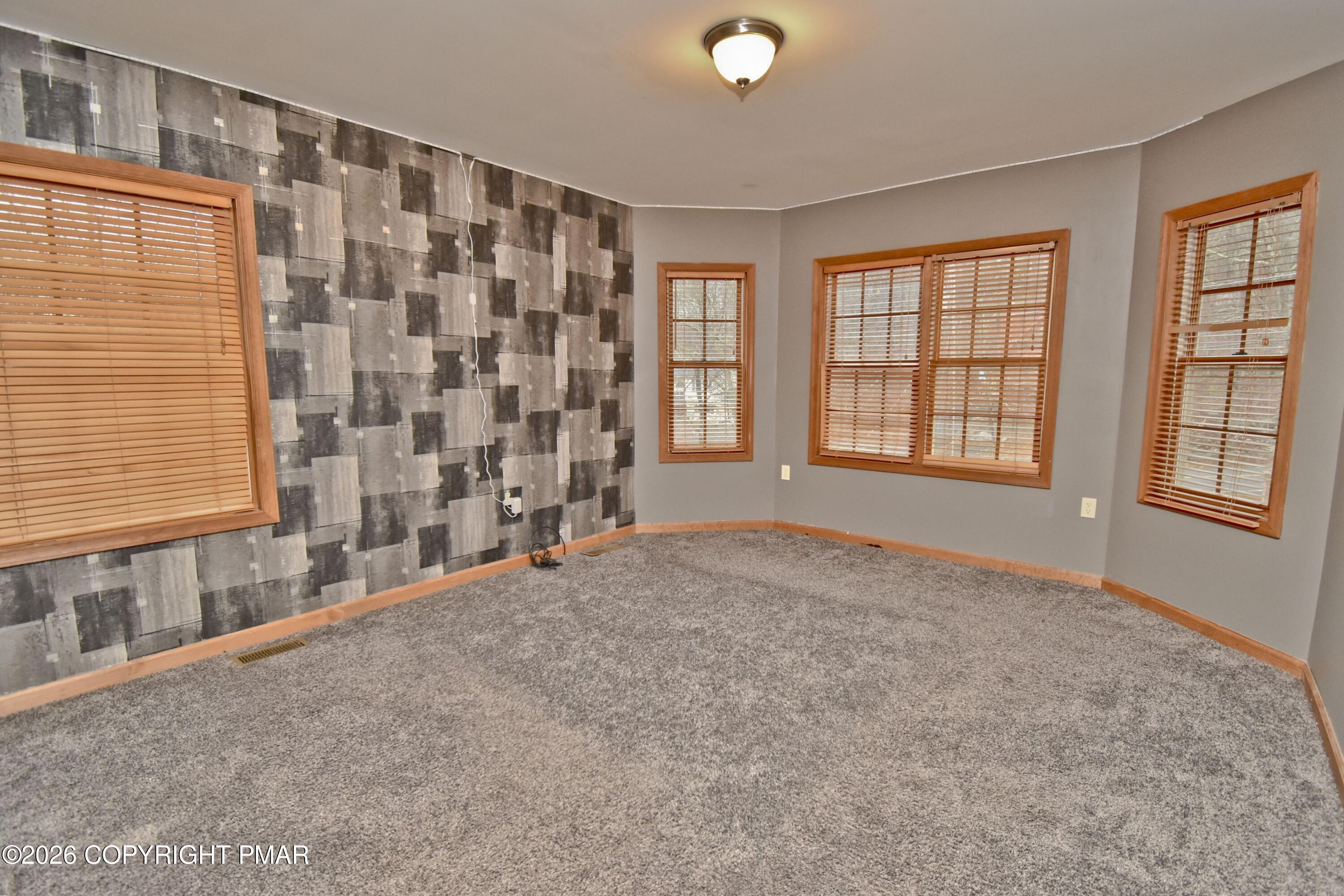 131 Canterbury Road Bushkill, PA 18324 - Photo 37 of 65 a view of an empty room with a window
