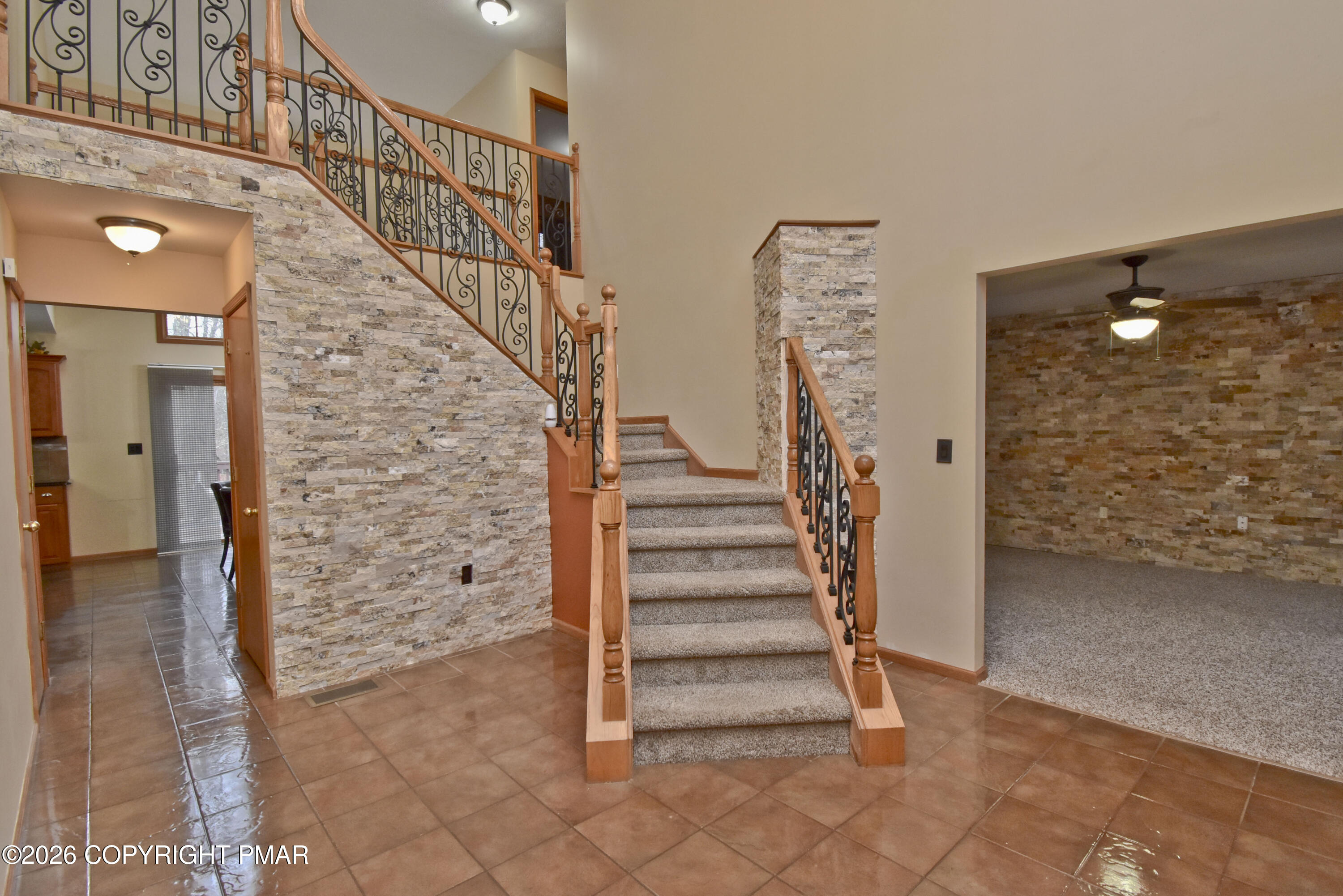 131 Canterbury Road Bushkill, PA 18324 - Photo 4 of 65 a view of entryway with wooden floor and stairs