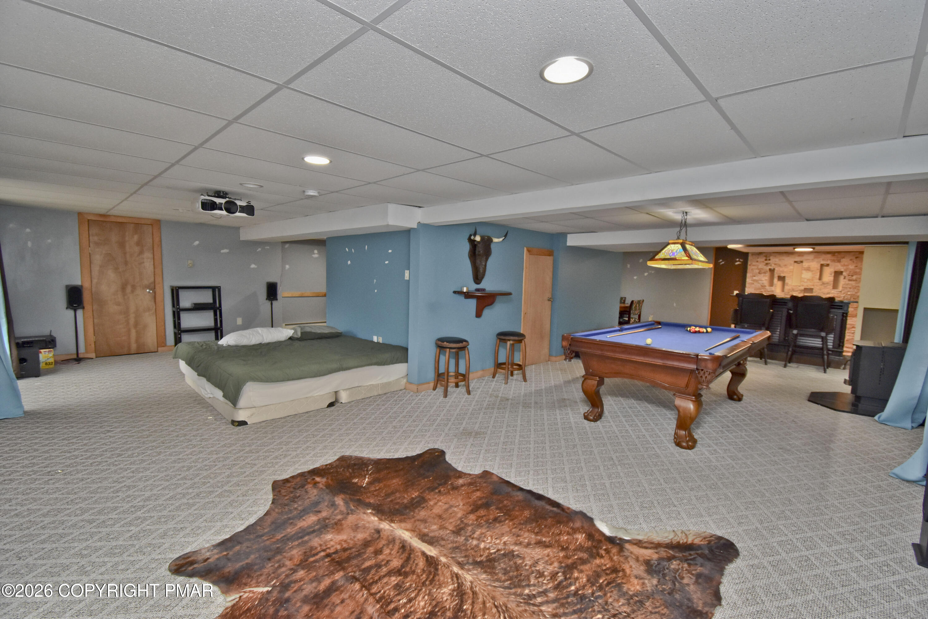 131 Canterbury Road Bushkill, PA 18324 - Photo 42 of 65 a living room with furniture a wooden floor and pool table