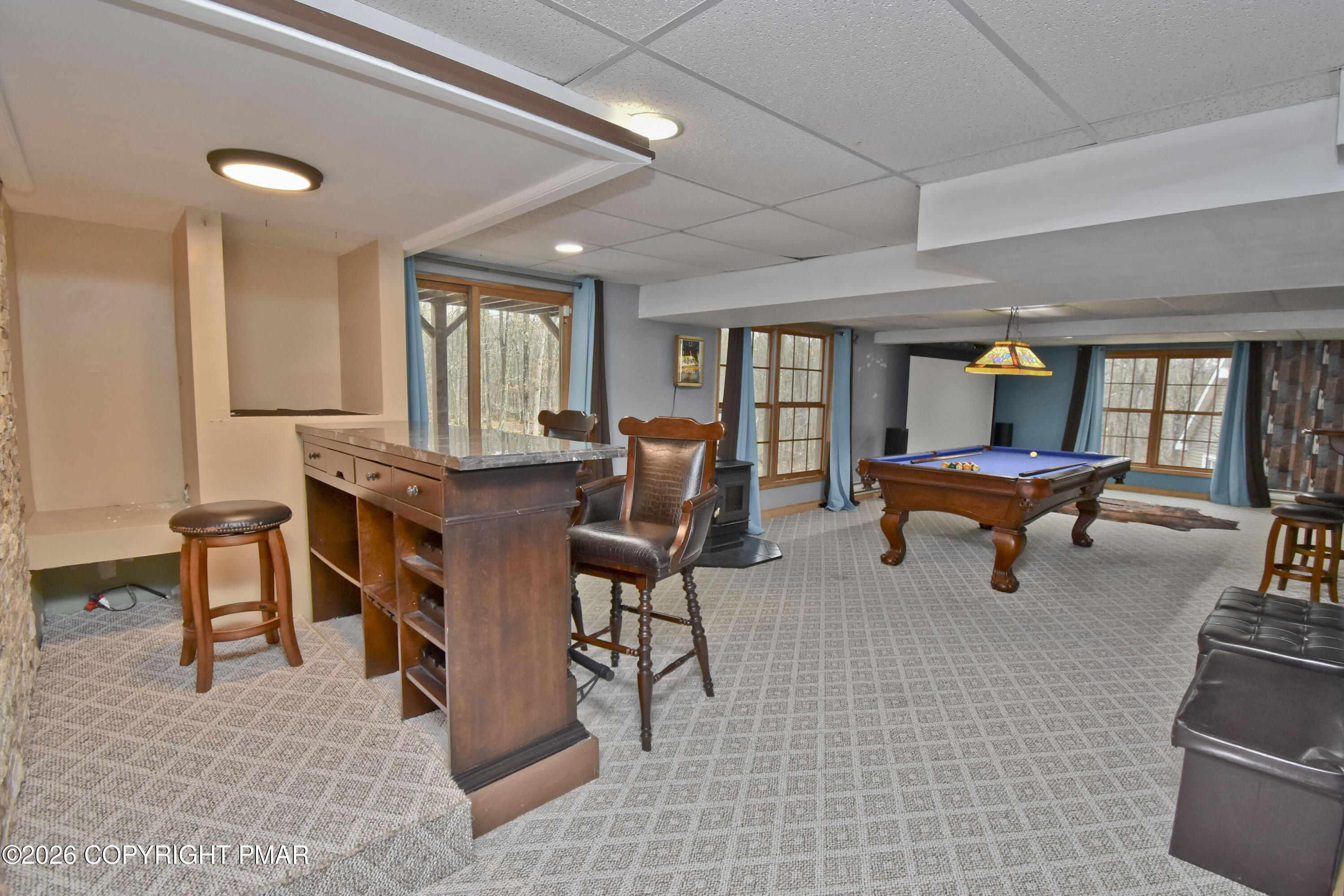 131 Canterbury Road Bushkill, PA 18324 - Photo 44 of 65 a living room with furniture and a large window