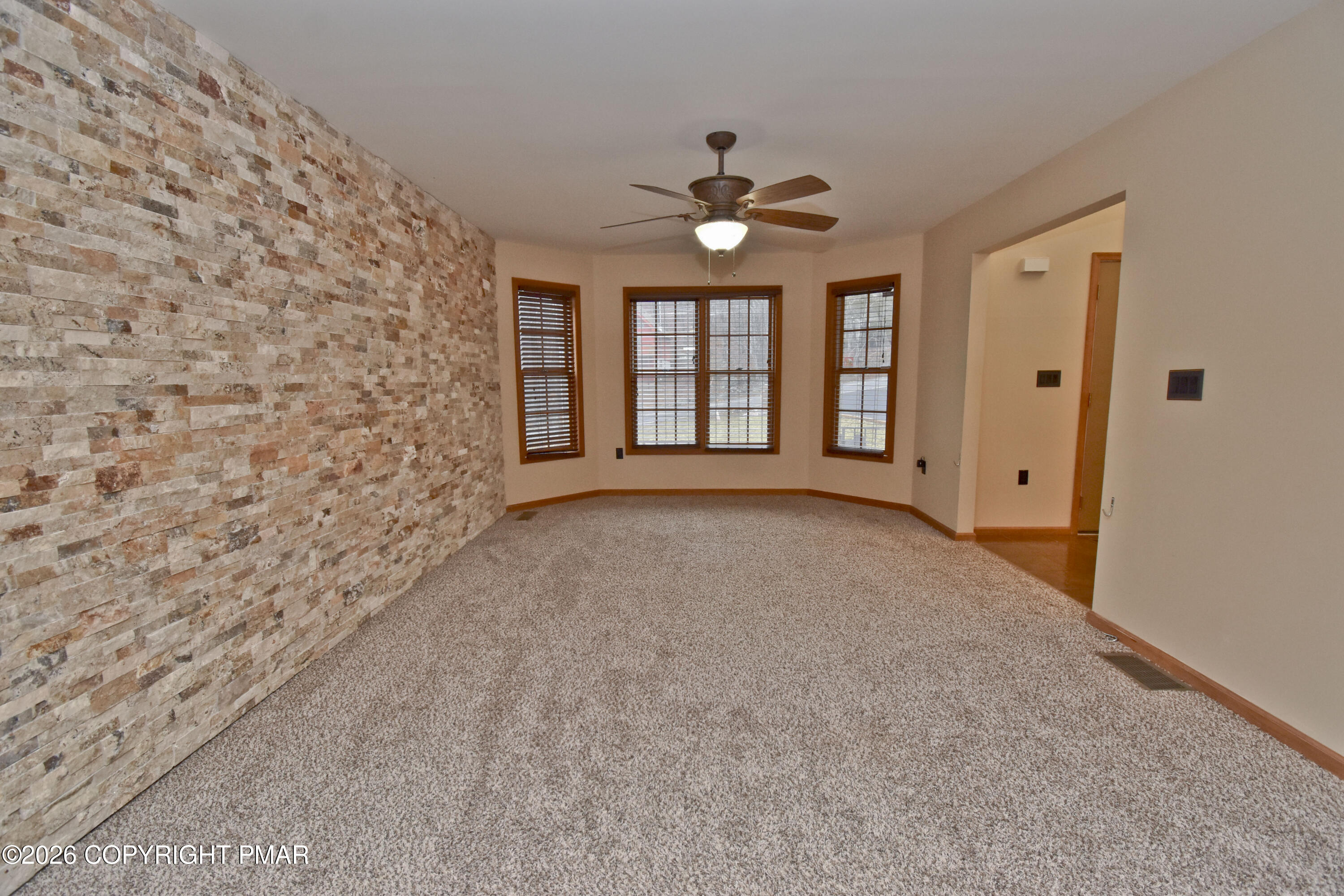 131 Canterbury Road Bushkill, PA 18324 - Photo 5 of 65 a view of an empty room with a window