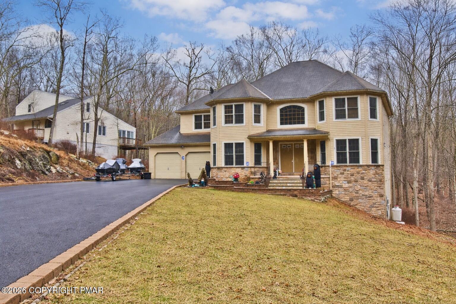 131 Canterbury Road Bushkill, PA 18324 - Photo 52 of 65 a front view of a house with yard porch and furniture