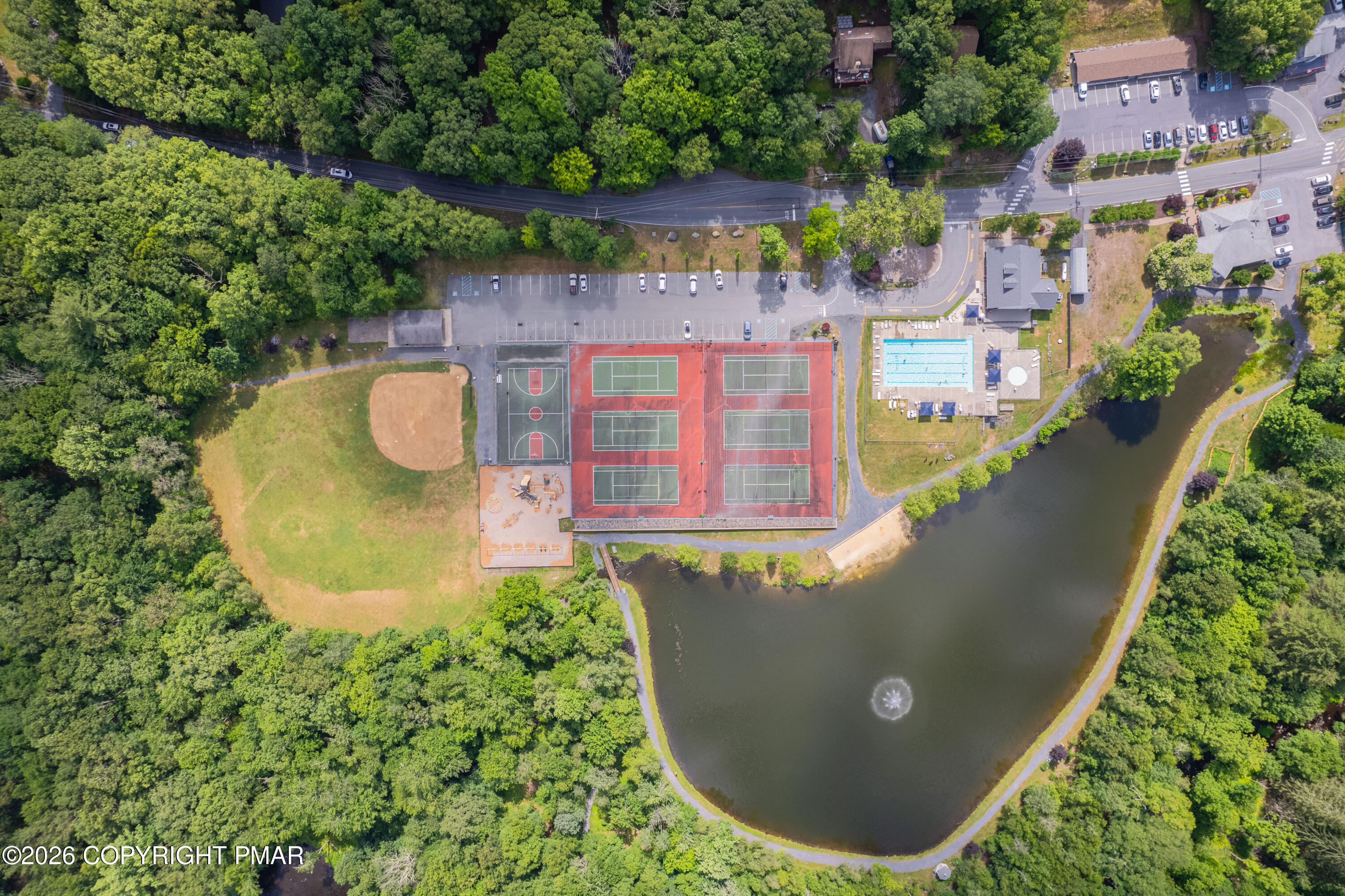 131 Canterbury Road Bushkill, PA 18324 - Photo 54 of 65 an aerial view of a house with a swimming pool
