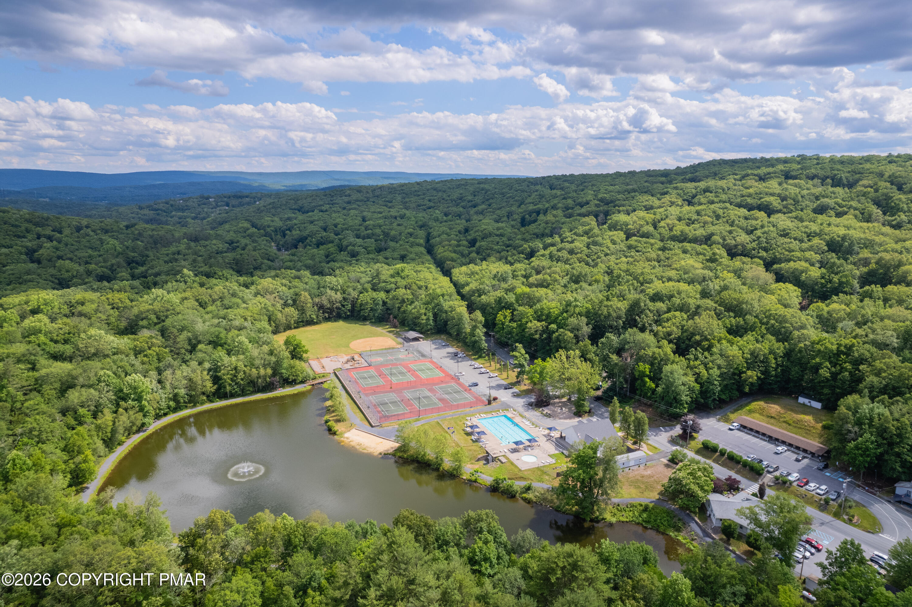 131 Canterbury Road Bushkill, PA 18324 - Photo 55 of 65 an aerial view of a house with a garden
