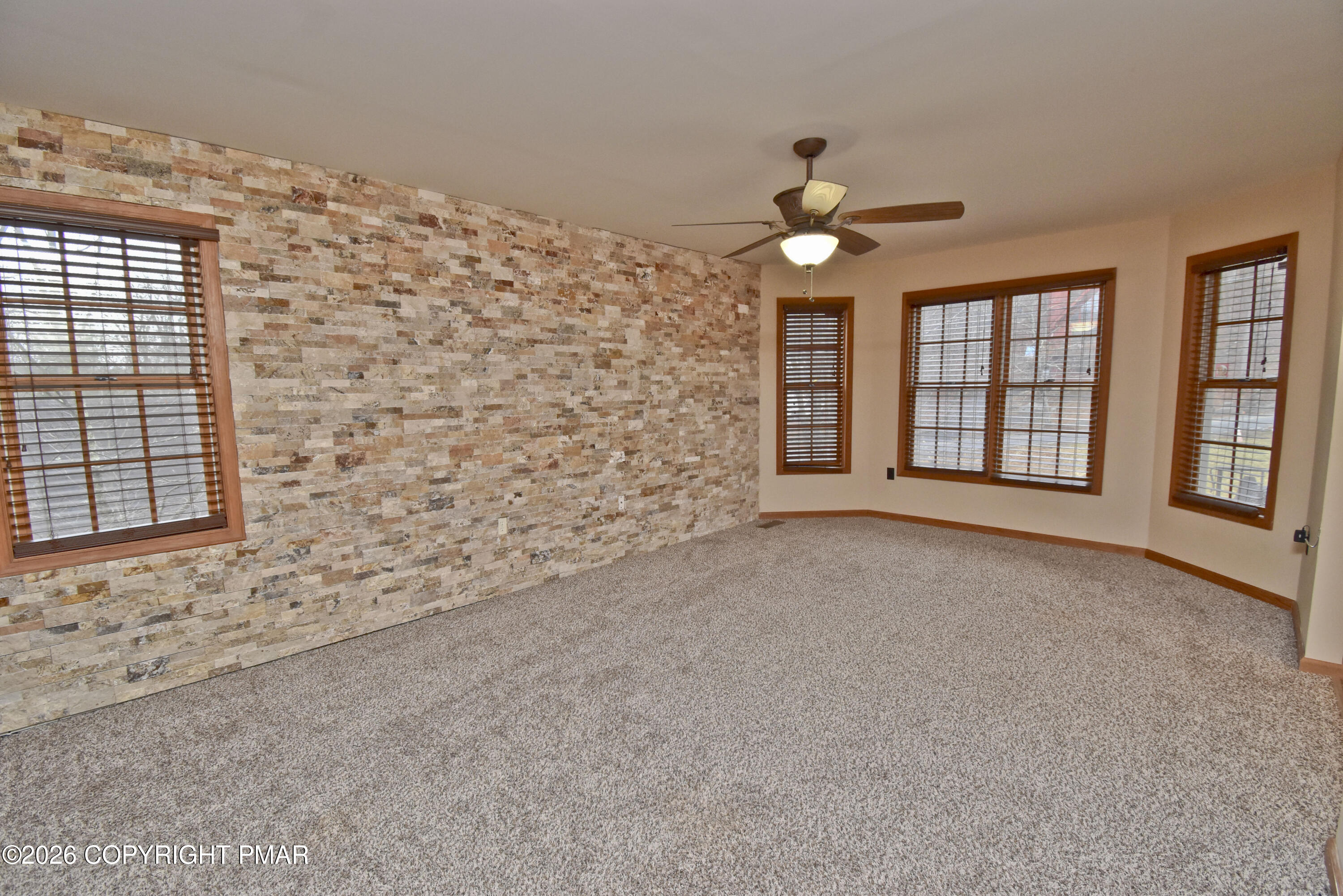 131 Canterbury Road Bushkill, PA 18324 - Photo 6 of 65 a view of an empty room with a window
