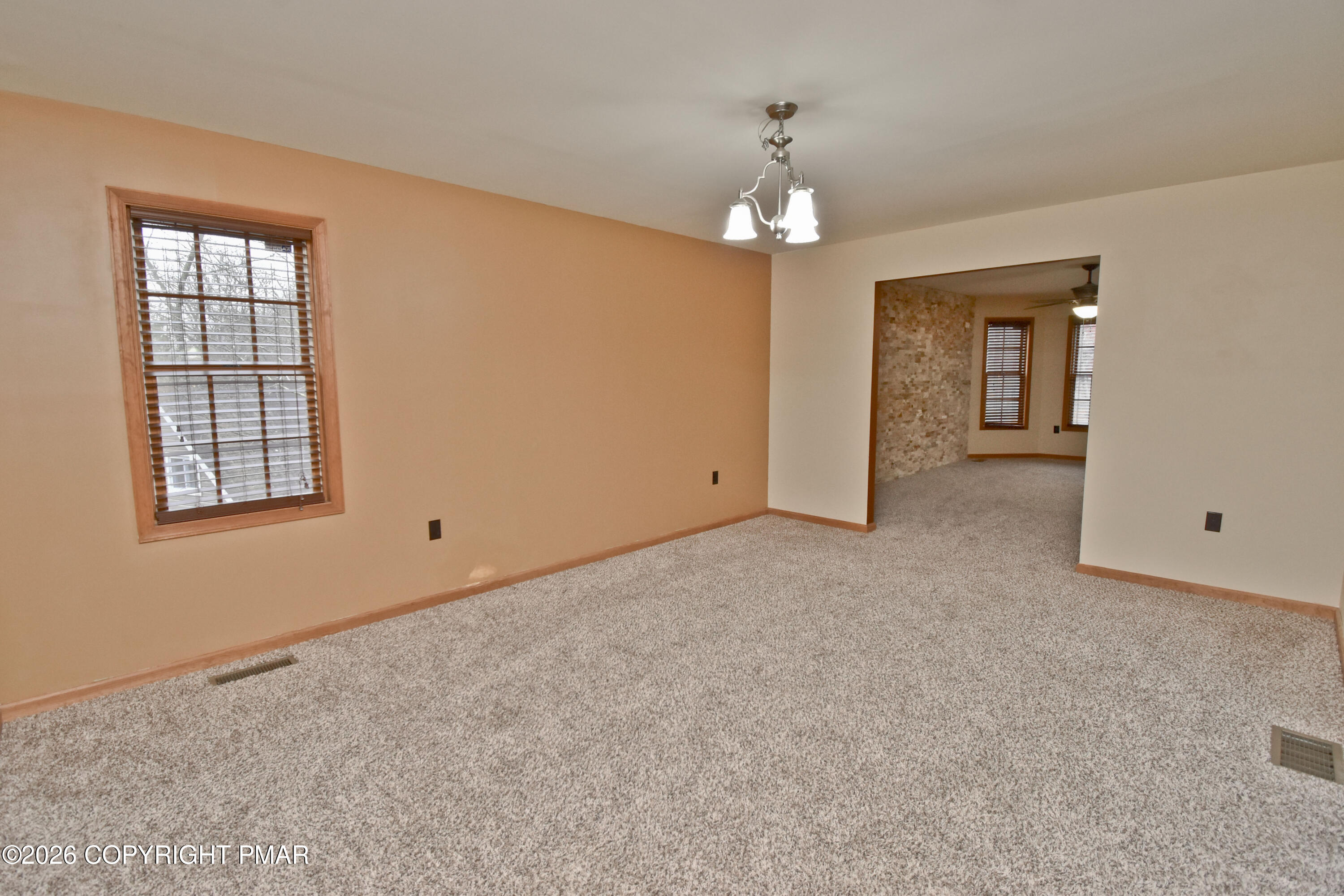 131 Canterbury Road Bushkill, PA 18324 - Photo 8 of 65 a view of an empty room with a window