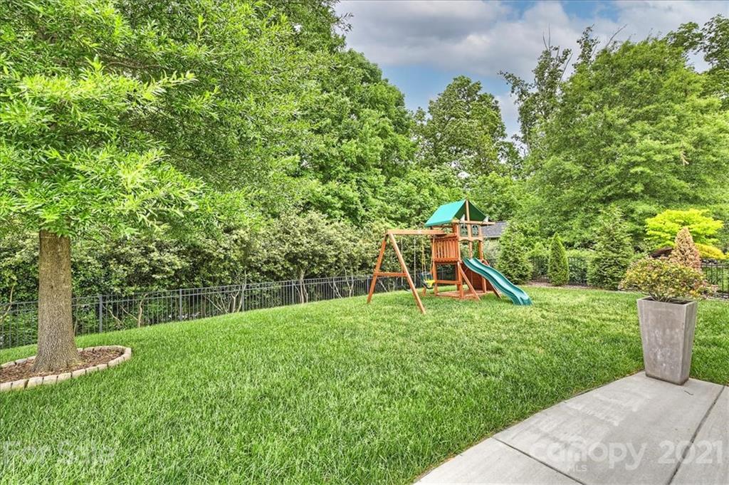 7015 Sedgewick Road Indian Trail, NC 28079 - Photo 7 of 14 a view of a backyard with a garden and plants