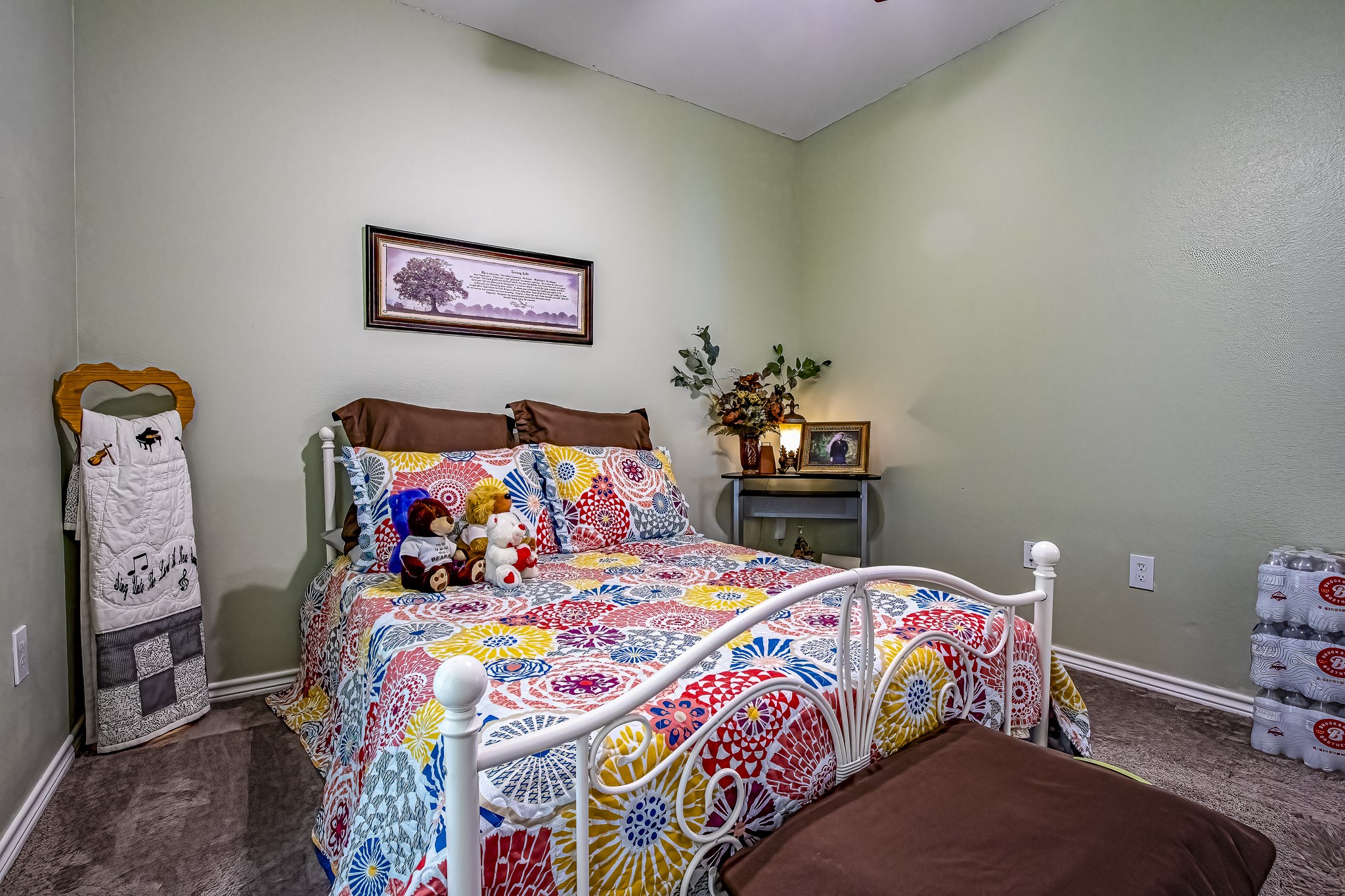 208 County Road 308 Cleveland, TX 77327 - Photo 13 of 32 a bedroom with a bed and a lamp on dresser