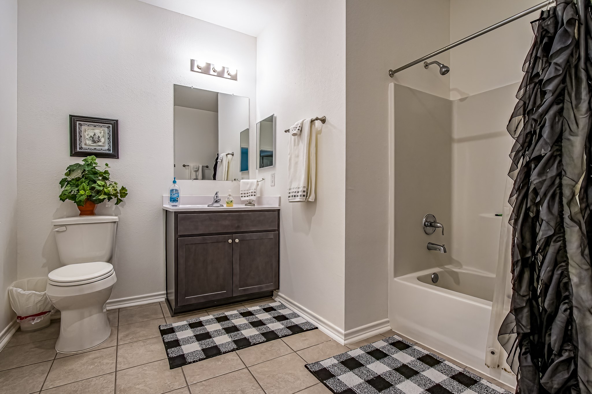 208 County Road 308 Cleveland, TX 77327 - Photo 14 of 32 a bathroom with a sink toilet and shower