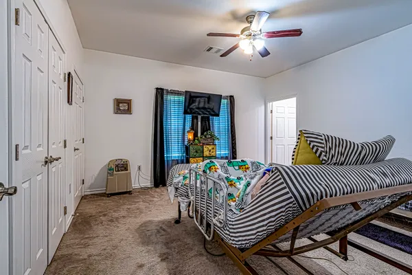 a bed room with furniture and wooden floor