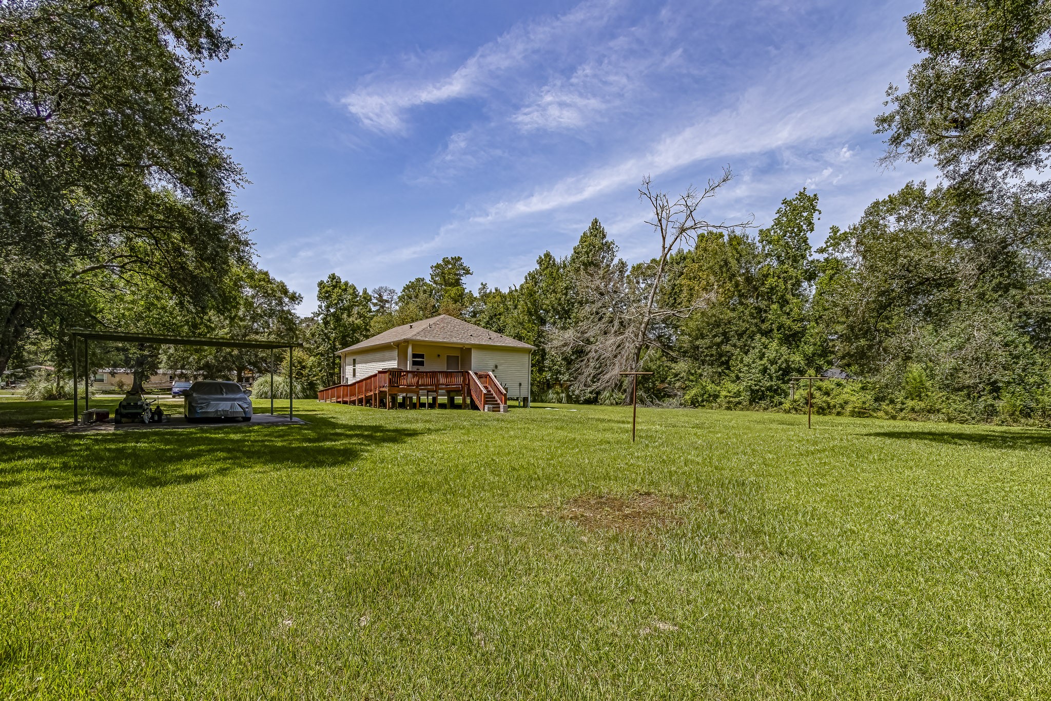 208 County Road 308 Cleveland, TX 77327 - Photo 23 of 32 a front view of a house with a yard