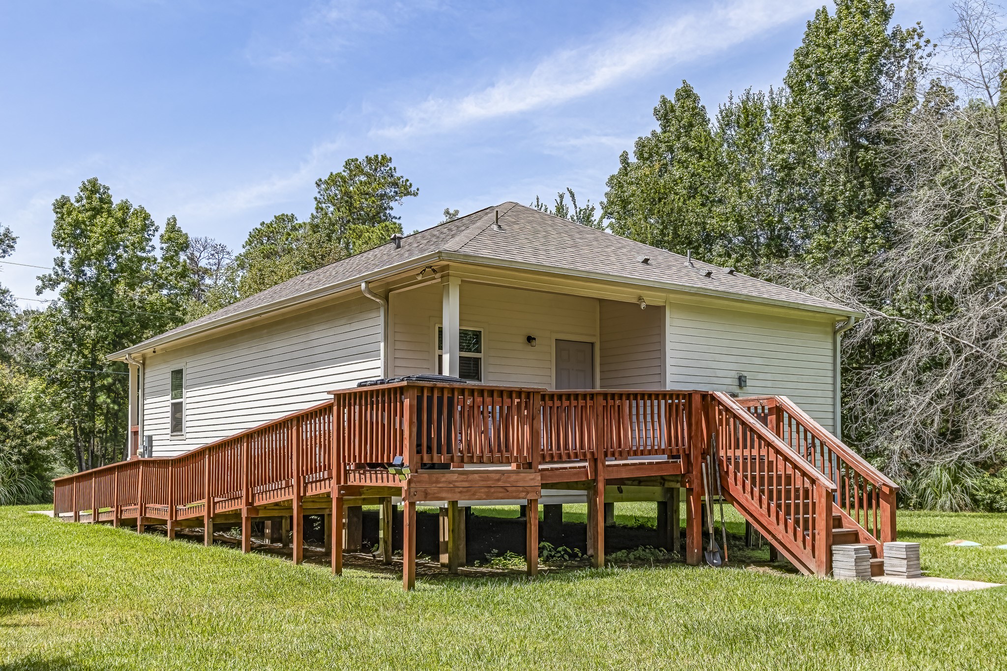 208 County Road 308 Cleveland, TX 77327 - Photo 24 of 32 a view of a house with a yard