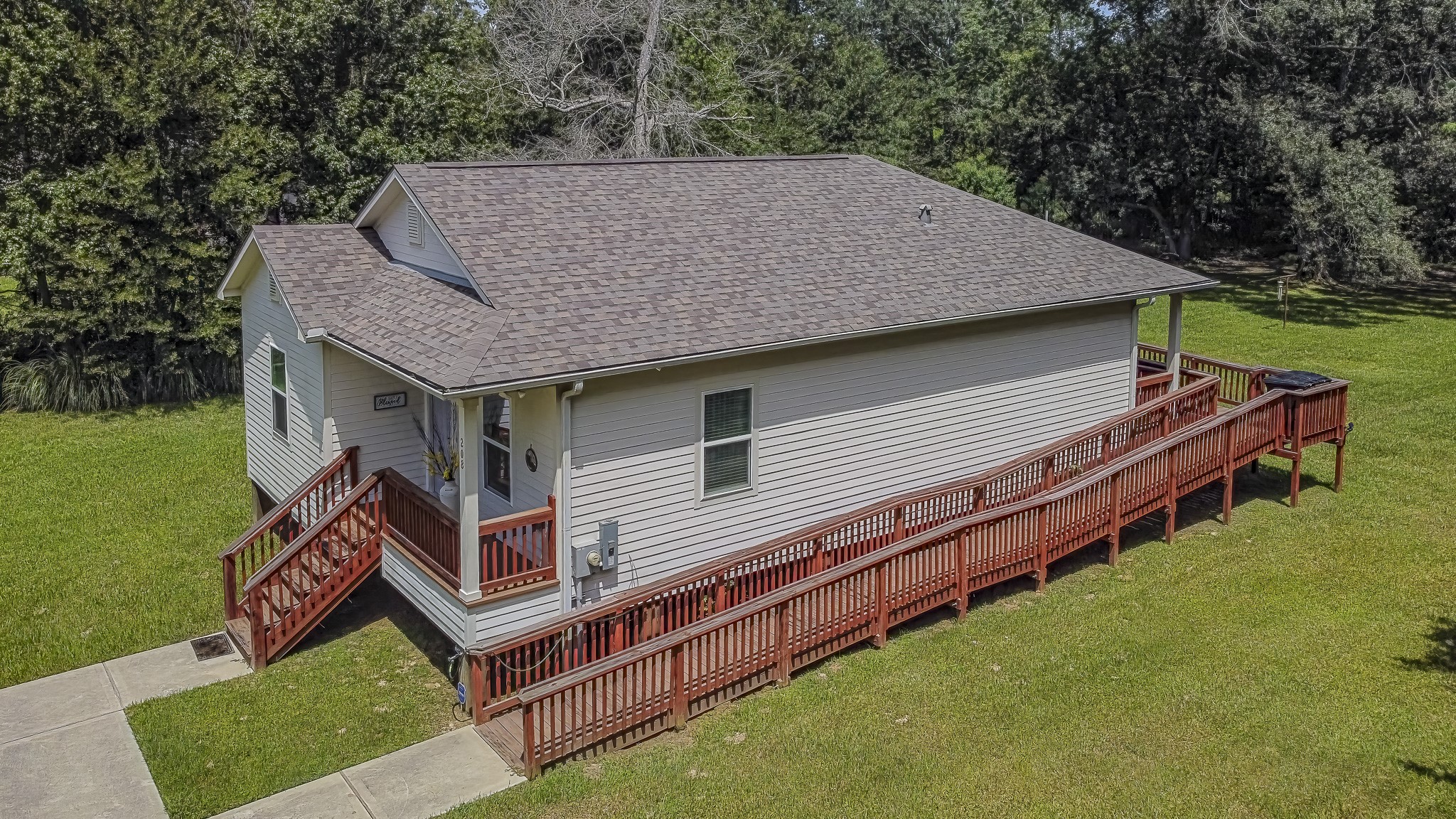 208 County Road 308 Cleveland, TX 77327 - Photo 27 of 32 a aerial view of a house with yard