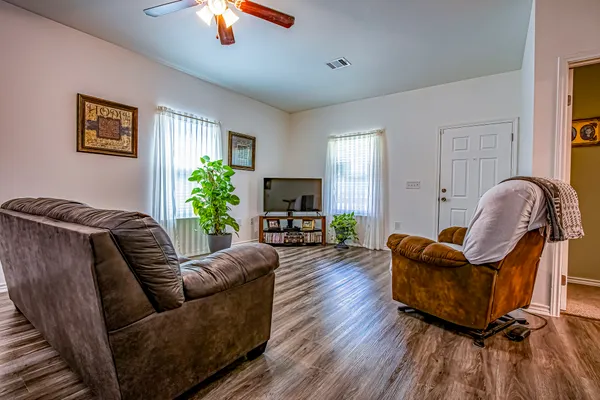 a living room with furniture and a fireplace