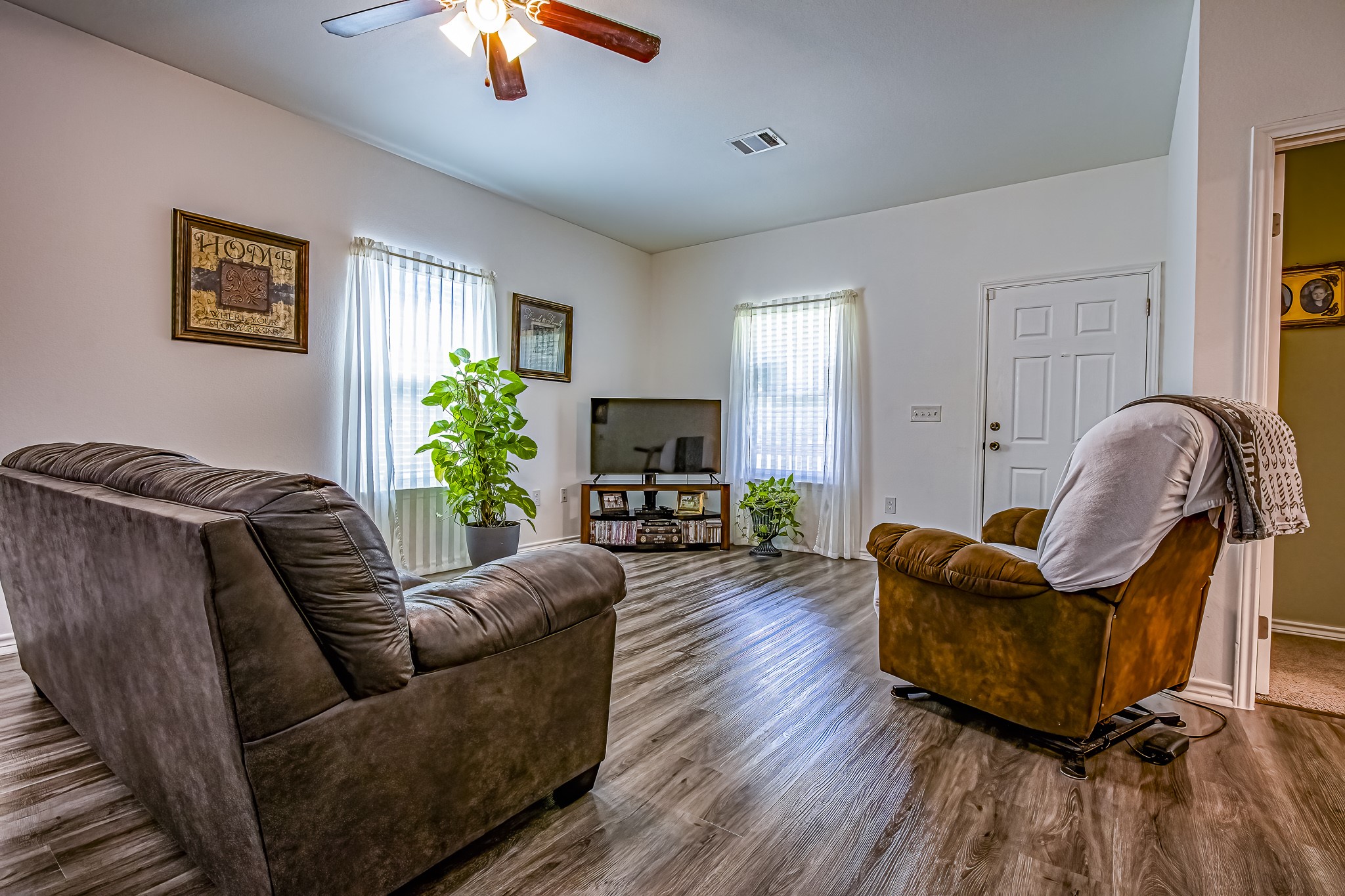 208 County Road 308 Cleveland, TX 77327 - Photo 5 of 32 a living room with furniture and a fireplace