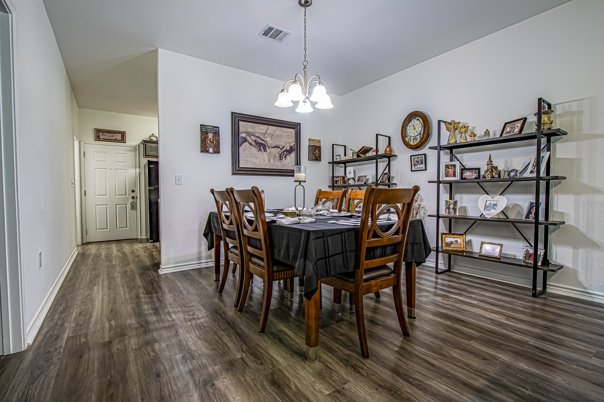 208 County Road 308 Cleveland, TX 77327 - Photo 6 of 32 a view of a dining room with furniture and wooden floor