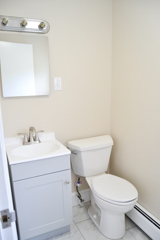 1031 Old Fall River Road Dartmouth, MA 02747 - Photo 13 of 32 a bathroom with a toilet sink and mirror
