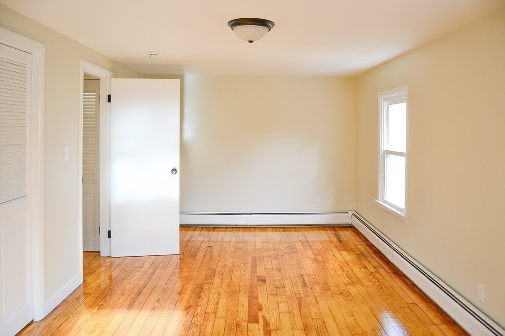 1031 Old Fall River Road Dartmouth, MA 02747 - Photo 15 of 32 a view of room with window and hardwood floor
