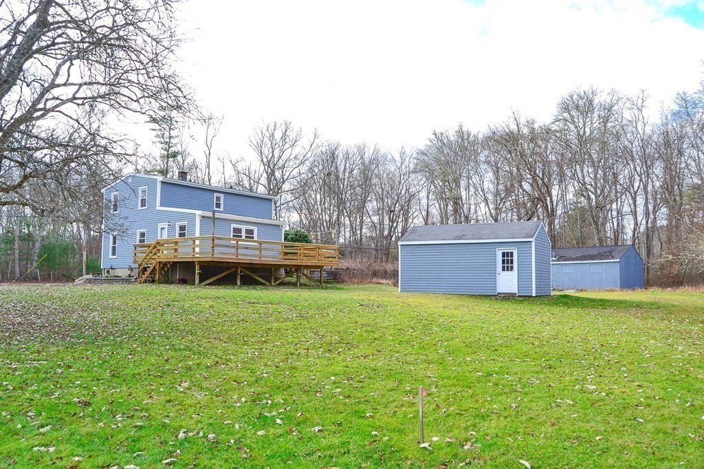 1031 Old Fall River Road Dartmouth, MA 02747 - Photo 22 of 32 a view of a house with a yard and trees