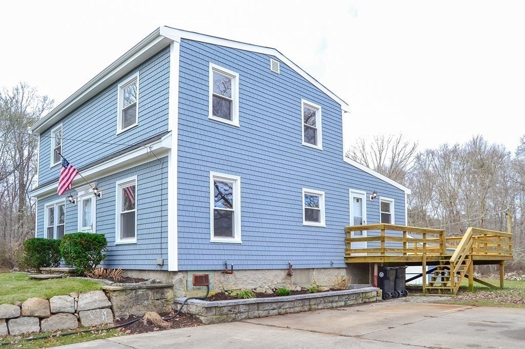 1031 Old Fall River Road Dartmouth, MA 02747 - Photo 27 of 32 a front view of a house with garden