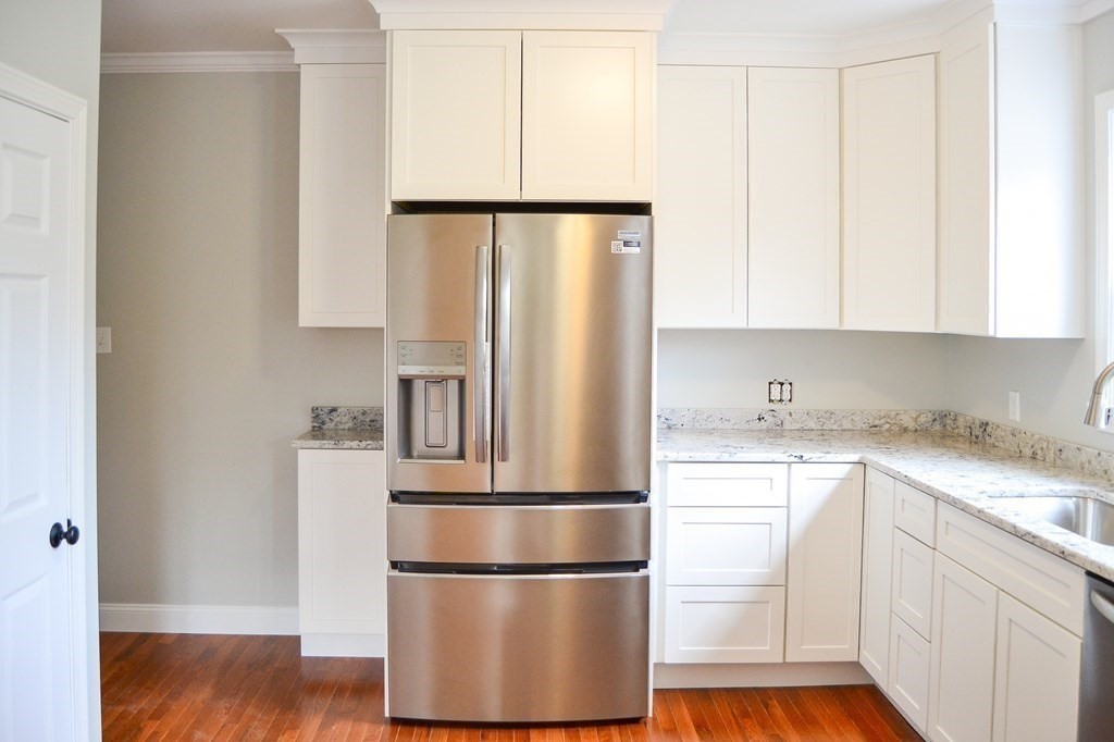 1031 Old Fall River Road Dartmouth, MA 02747 - Photo 5 of 32 a kitchen with stainless steel appliances granite countertop a refrigerator and a sink