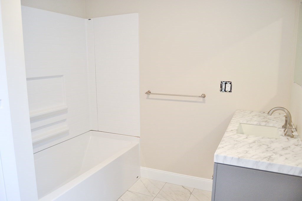 1031 Old Fall River Road Dartmouth, MA 02747 - Photo 8 of 32 a bathroom with a sink and a shower
