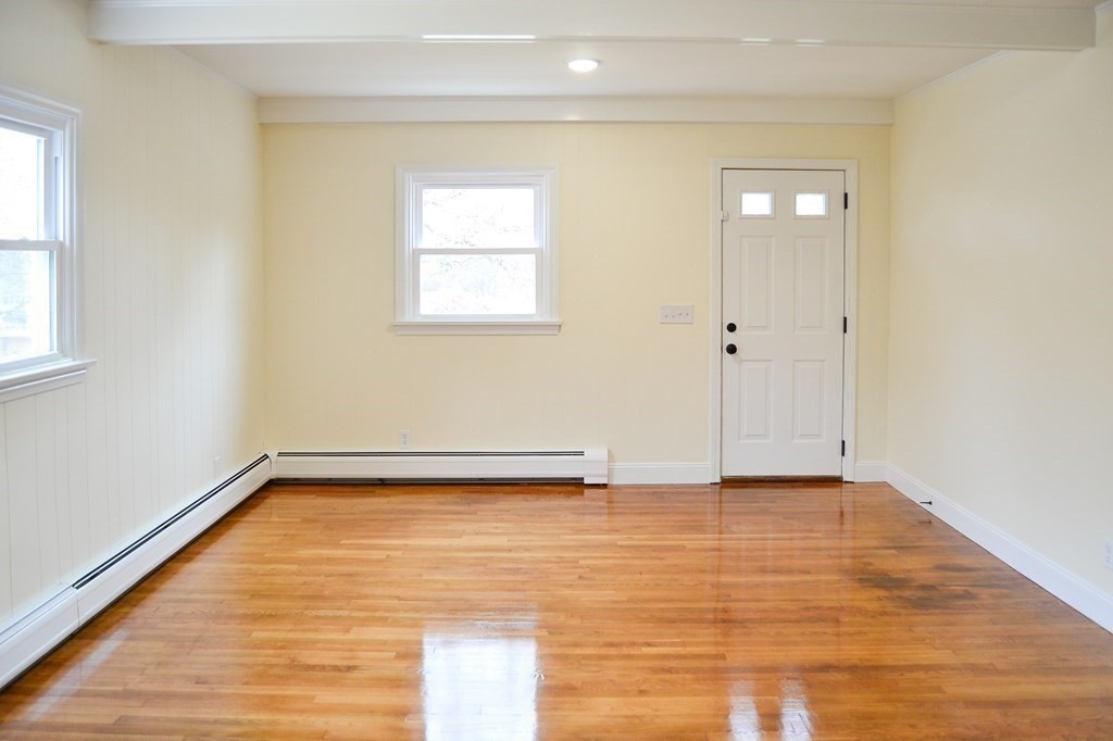 1031 Old Fall River Road Dartmouth, MA 02747 - Photo 9 of 32 a view of a room with wooden floor and a window