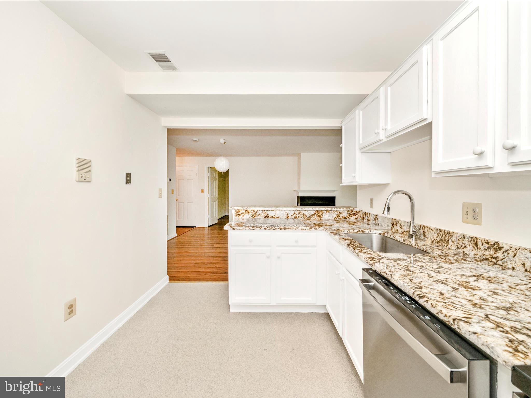 122 Kendrick Place, Unit 24 Gaithersburg, MD 20878 - Photo 19 of 43 a large kitchen with kitchen island a sink stainless steel appliances and cabinets
