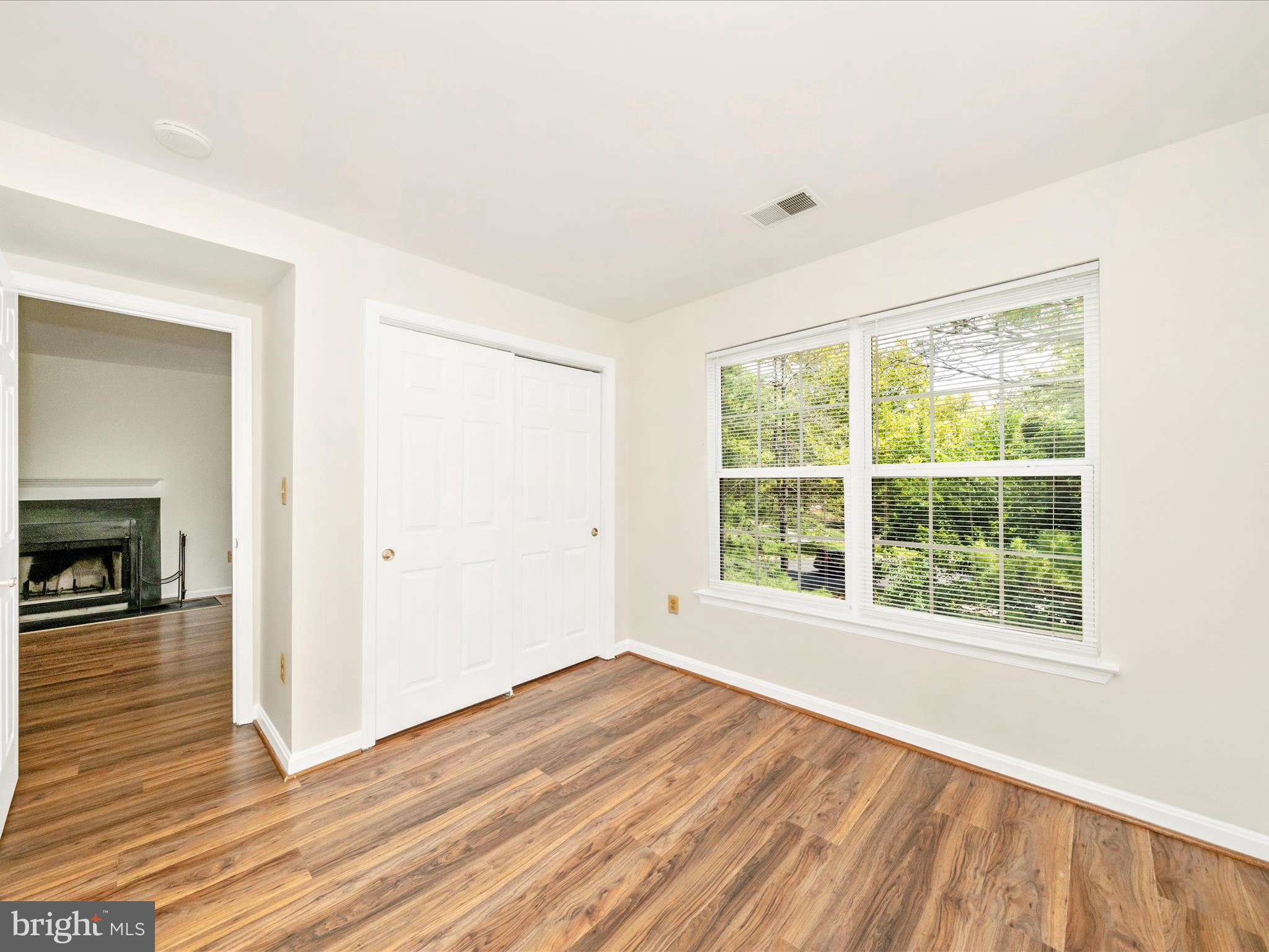 122 Kendrick Place, Unit 24 Gaithersburg, MD 20878 - Photo 25 of 43 a view of empty room with wooden floor and fireplace