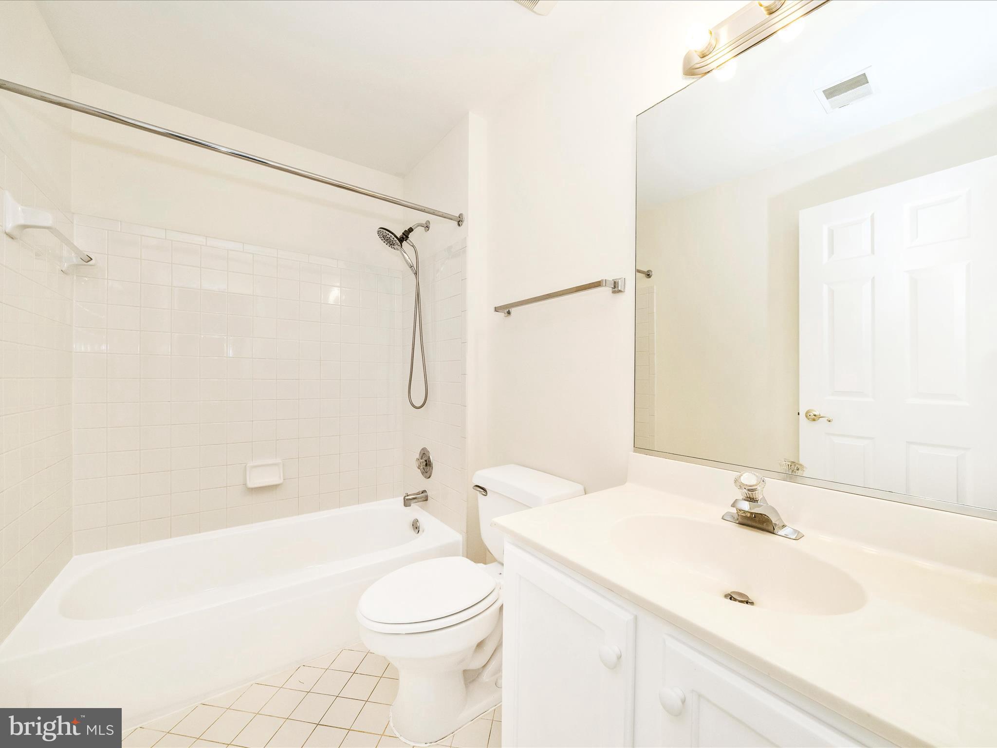 122 Kendrick Place, Unit 24 Gaithersburg, MD 20878 - Photo 37 of 43 a bathroom with a sink a toilet and shower