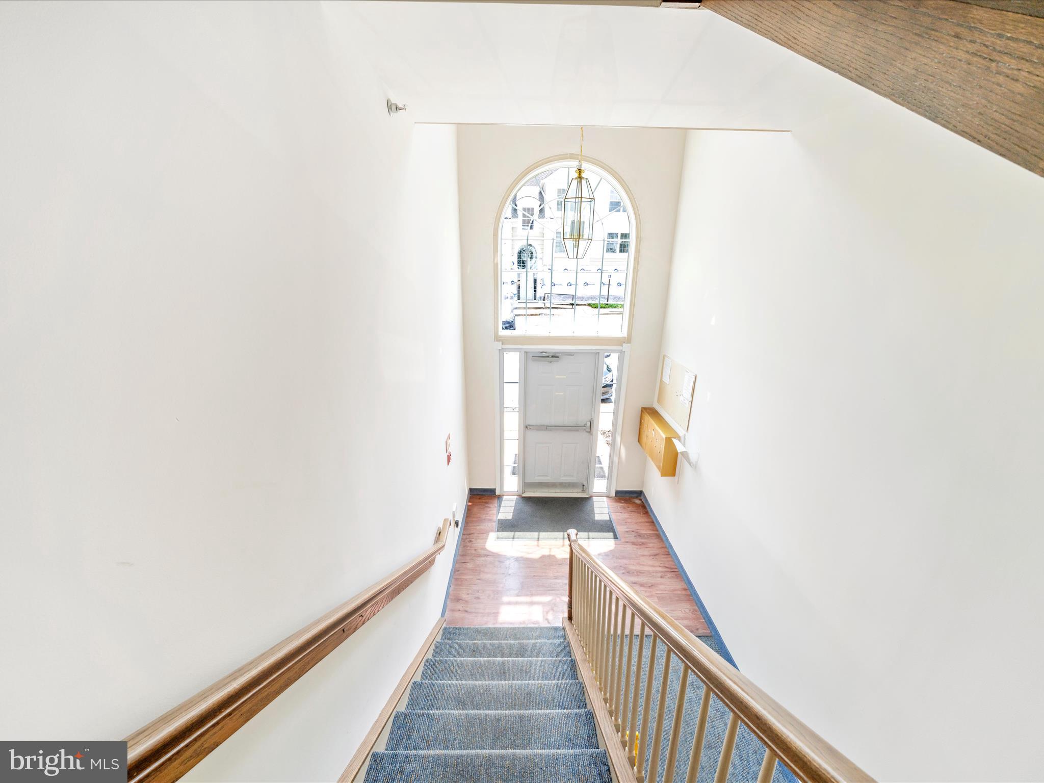 122 Kendrick Place, Unit 24 Gaithersburg, MD 20878 - Photo 40 of 43 a view of a hallway with wooden floor