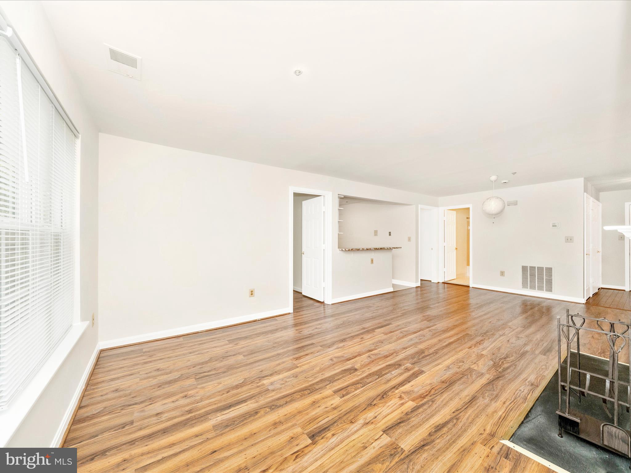 122 Kendrick Place, Unit 24 Gaithersburg, MD 20878 - Photo 5 of 43 a view of empty room with wooden floor and fan