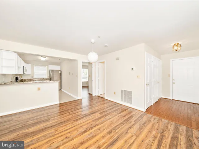 a view of kitchen with wooden floor