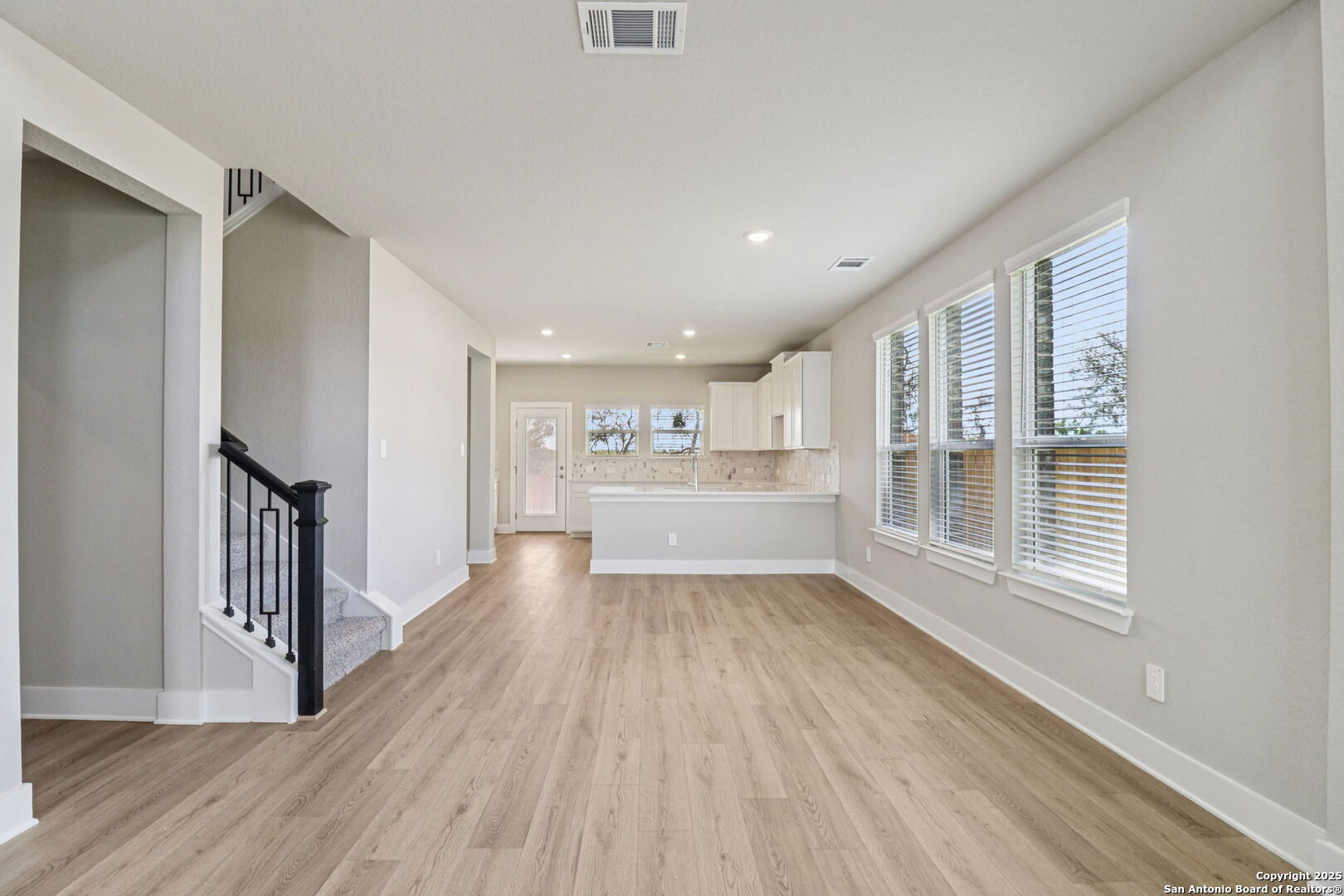 12602 Winding Butte Schertz, TX 78154 - Photo 14 of 46 a view of a room with wooden floor and a window