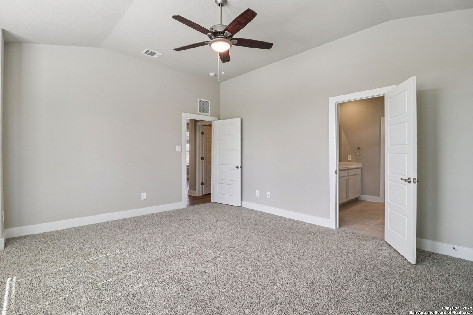 12602 Winding Butte Schertz, TX 78154 - Photo 19 of 46 a view of an empty room and a ceiling fan