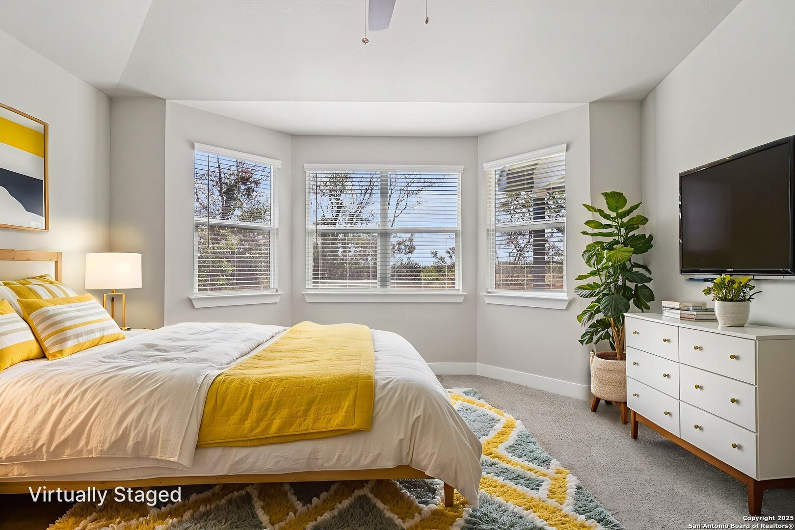 12602 Winding Butte Schertz, TX 78154 - Photo 21 of 46 a bedroom with a bed and flat screen tv