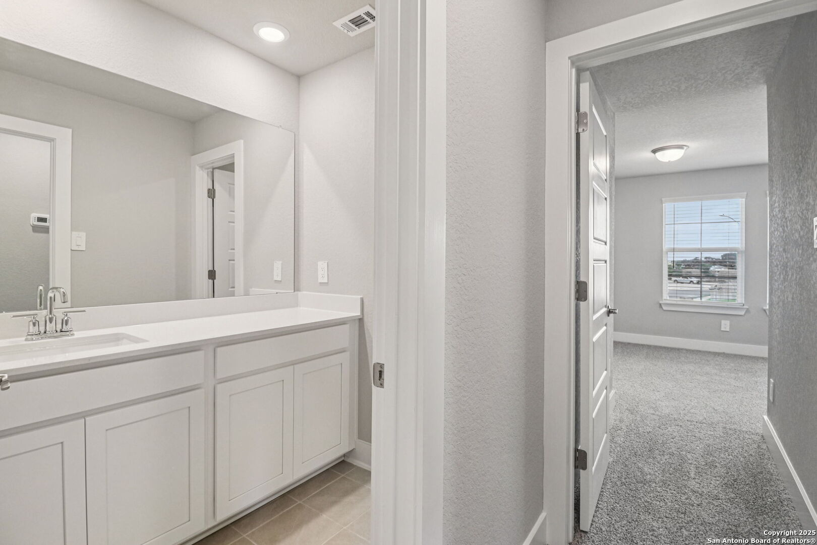 12602 Winding Butte Schertz, TX 78154 - Photo 31 of 46 a bathroom with 2 sink and a mirror